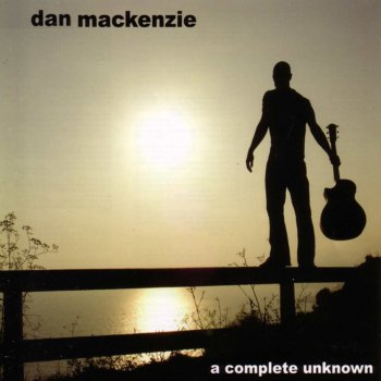 Dan Mackenzie Sitting On a Train